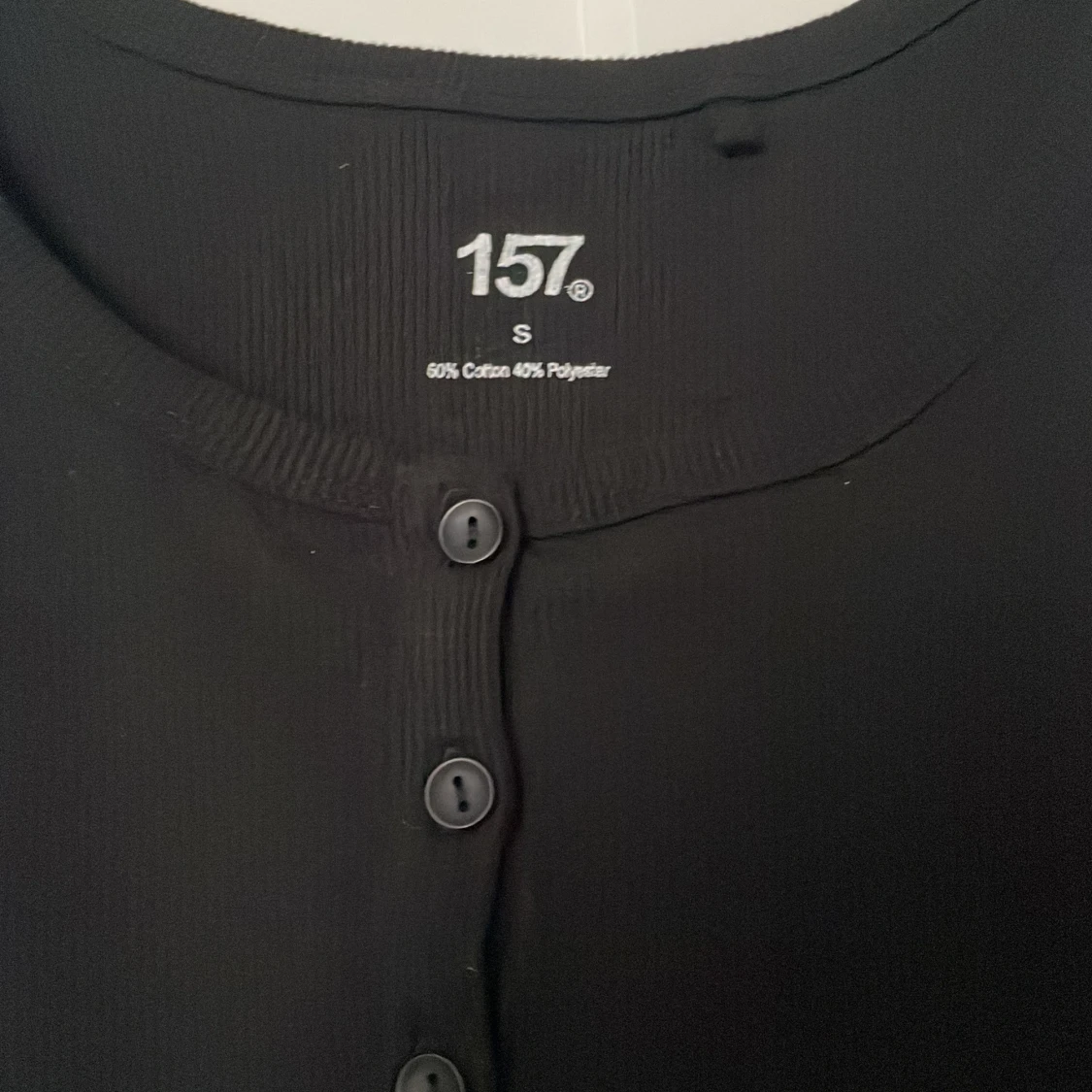 Svart linnetopp från 157 - 2