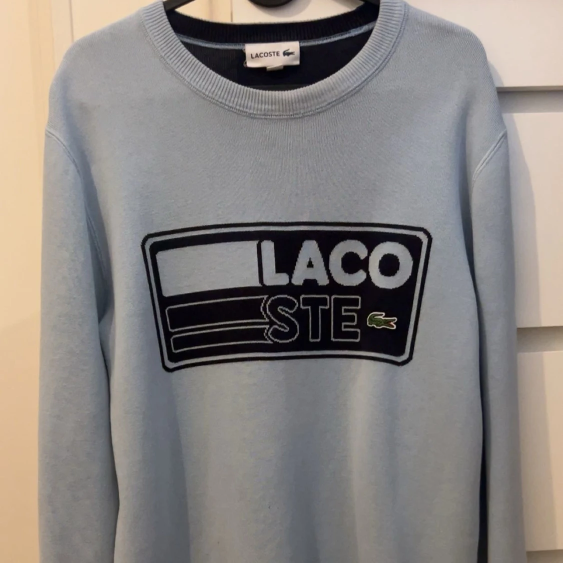 Ljusblå sweatshirt från Lacoste
