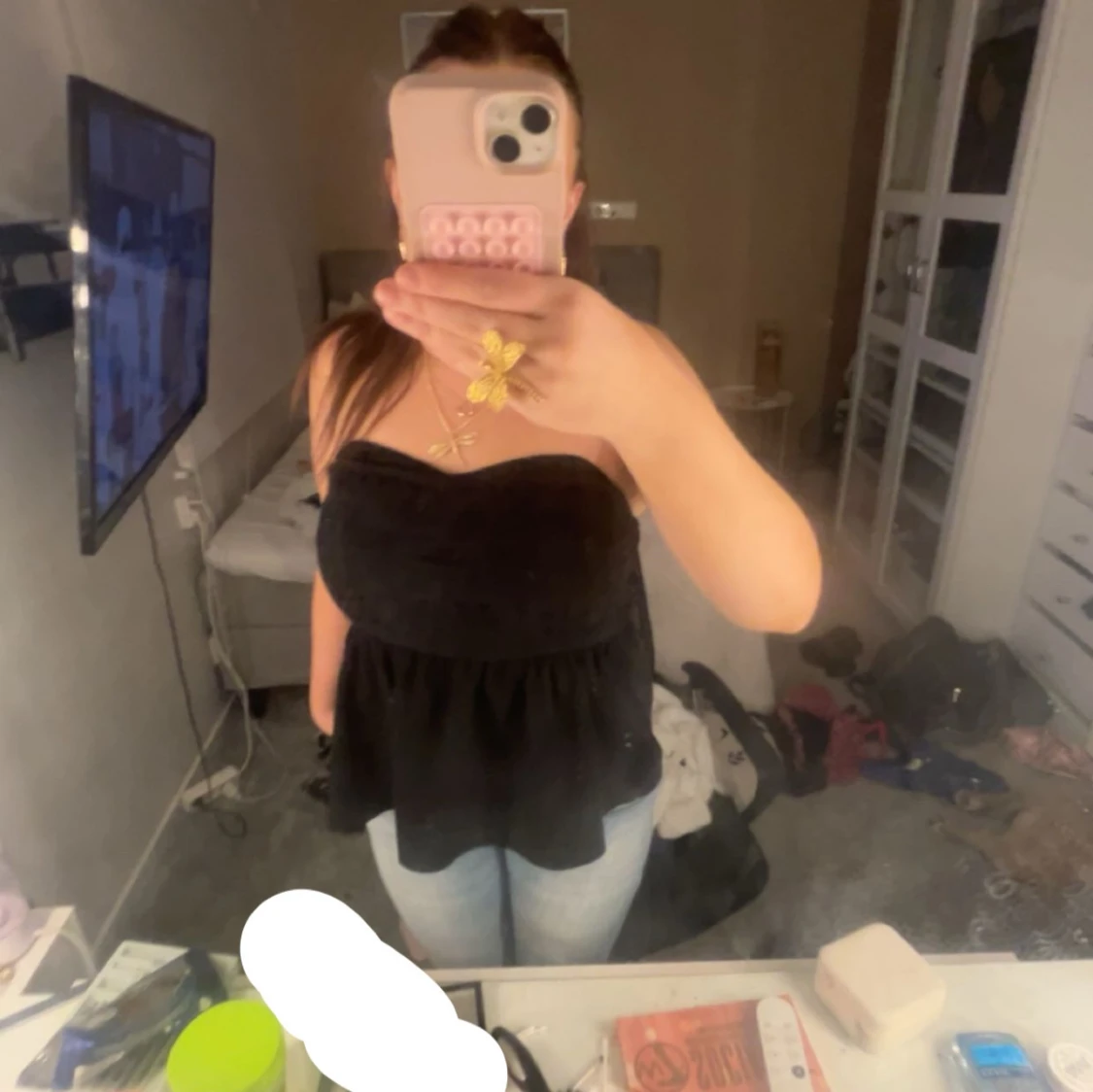 Svart axelbandslös topp