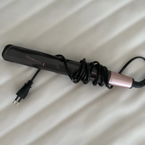 Plattång,locktång  - Kombinerad plattång & locktång från Remington. Använd 1 gång