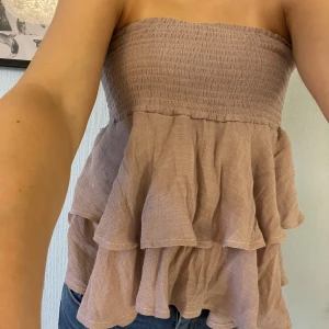 Kjol/topp - En jättefin kjol som är supersnygg som topp också! Knappt använd! Stretchigt material.