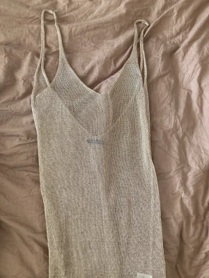 Brand new- sheer/ see through long rosegold dress - Brand new- sheer/ see through long rosegold dress. Slits.  Smoke and pet free home 