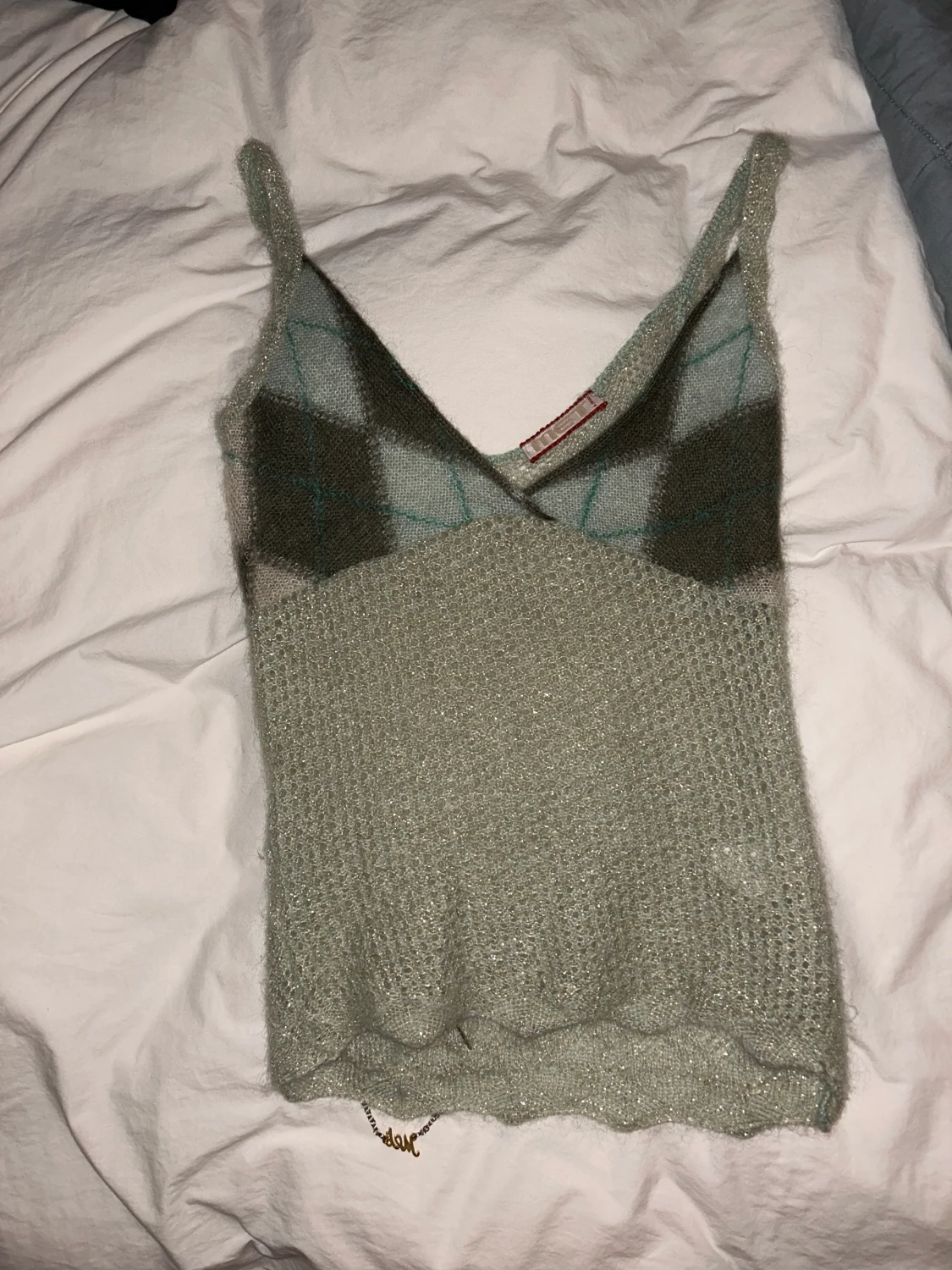 Glittrig stickad topp