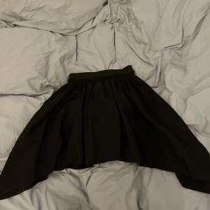 Black Mini Skirt from MM6 Maison Martin Margiela - One size  Very cute and punky, goes well with long boots  Only worn a few times 