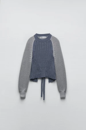 Rygglös stickad tröja - Stl M. Liten i storleken/kan passa någon med xs/s. Helt oanvänd