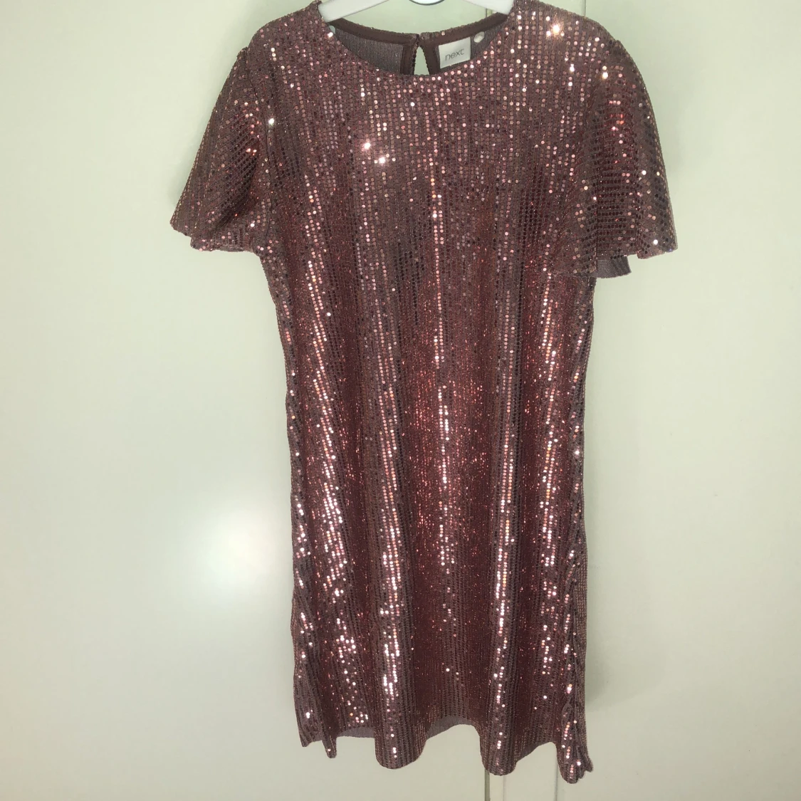 Rosa gllitrig klänning