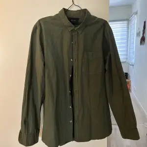 Green shirt. Worn maybe once or twice