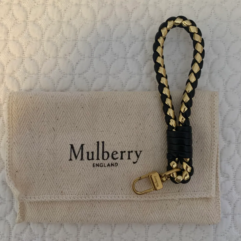 Mullberry nyckelring ,oanvänd med tillhörande dustbag . Övrigt.