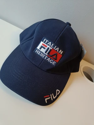 Fila keps i färgen blå! Nyskick!  - Fila keps i färgen blå! Nyskick! Endast för 200 kr! 