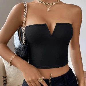 Topp - en svart topp som aldrig kommit till användning, skriv för egna bilder.🌼