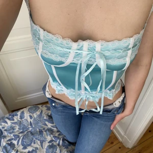 Blå korsettop - En babyblå korsettop som jag köpt från depop⭐️💙 Jättebra kvalité och så tre sätt att anpassa storleken så att den passar perfekt💕