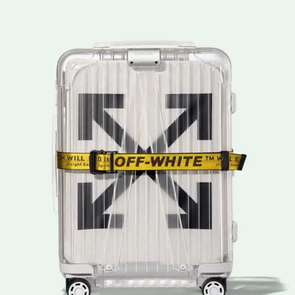 Virgil Abloh, now passed away, with Rimowa created this See Trough Carry on bag.   DS (Dead Stock) brand new. Included the fashion Off White Yellow Luggage Belt often seen as a fashion accessorie. . Väskor.