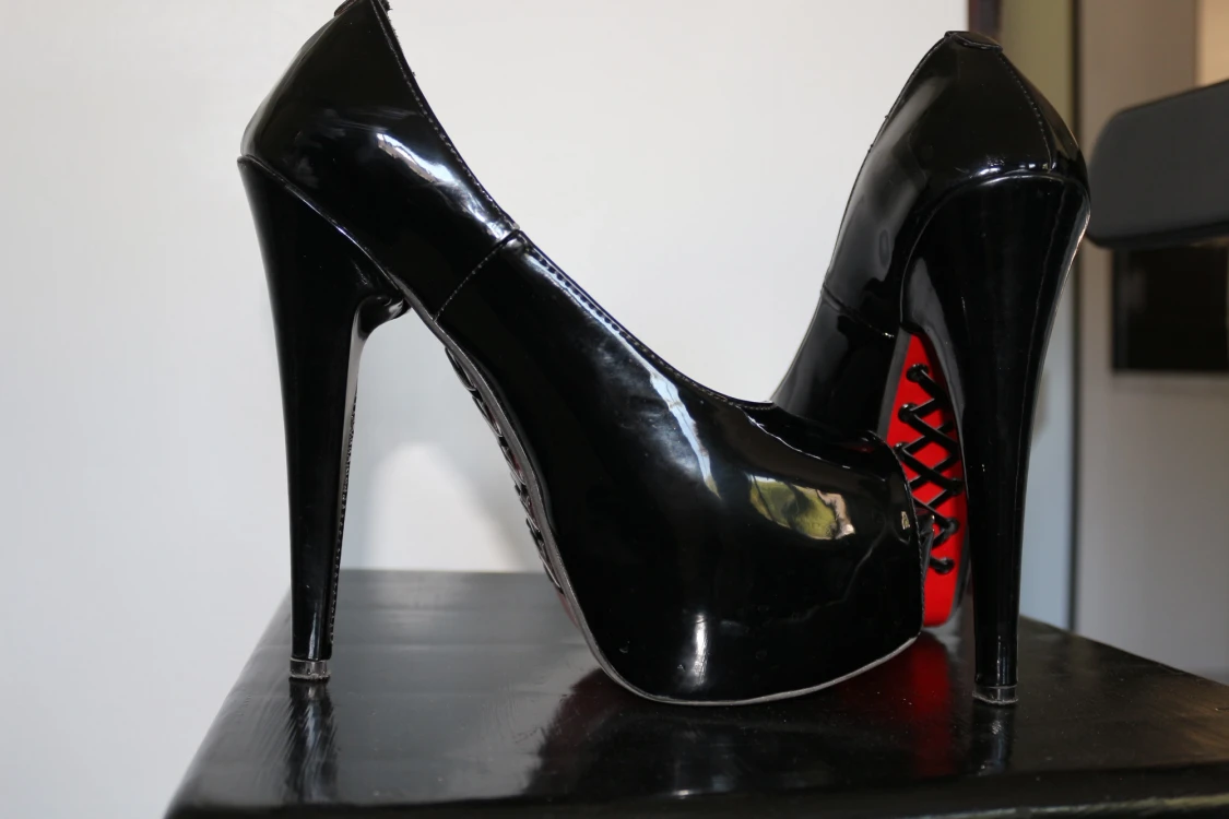 Black heels with Red bottom ( Very Good Condition )