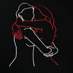 Girl in red t-shirt  - Svart girl in red t-shirt med två kramandes kvinnor broderat på. Storlek M, knappt använd. Ena kvinnan är broderad med vit tråd & andra med röd tråd. Vid övre kanten på ryggen står det ”girl in red”.  Gillar den mycket, men har för mycket kläder:) Köpare betalar frakt.