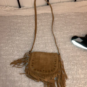 Brun vintage väska - En brun, fin, oanvänd vintage väska. 