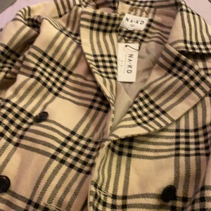 Kappa NA-KD - Oanvänd kappa strl 34, lång