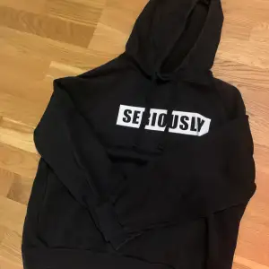 Black hoodie “seriously” text with a hood