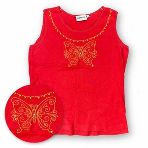 Topp  - Topp från Cappuccini, storlek S. Modellen använder vanligtvis storlek S / M och är 169cm för referens.  100% bomull. Byst bredd 45cm och Längd 55cm. Spårbar frakt på 66kr är inräknad i priset. 