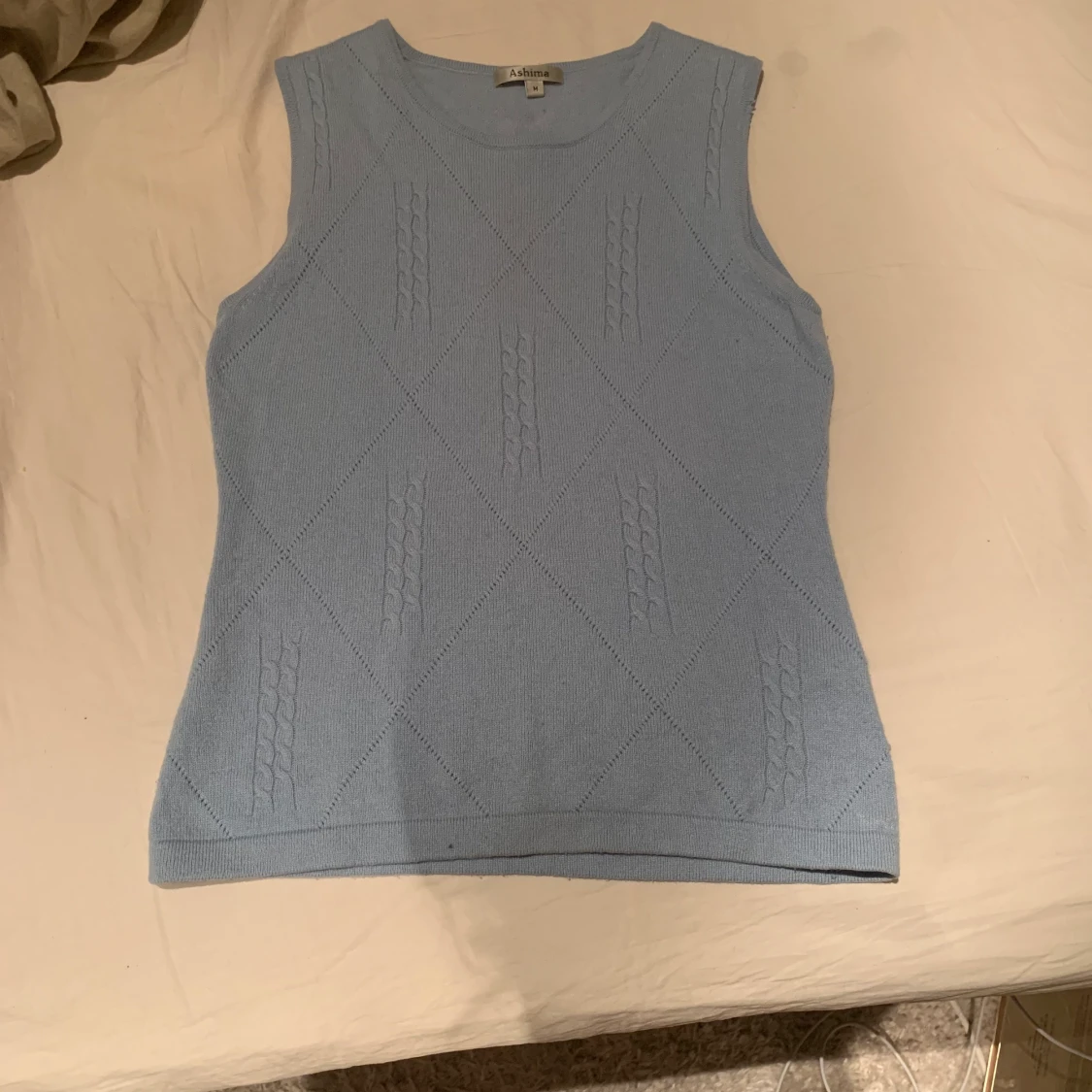 Blå stickad väst - 90