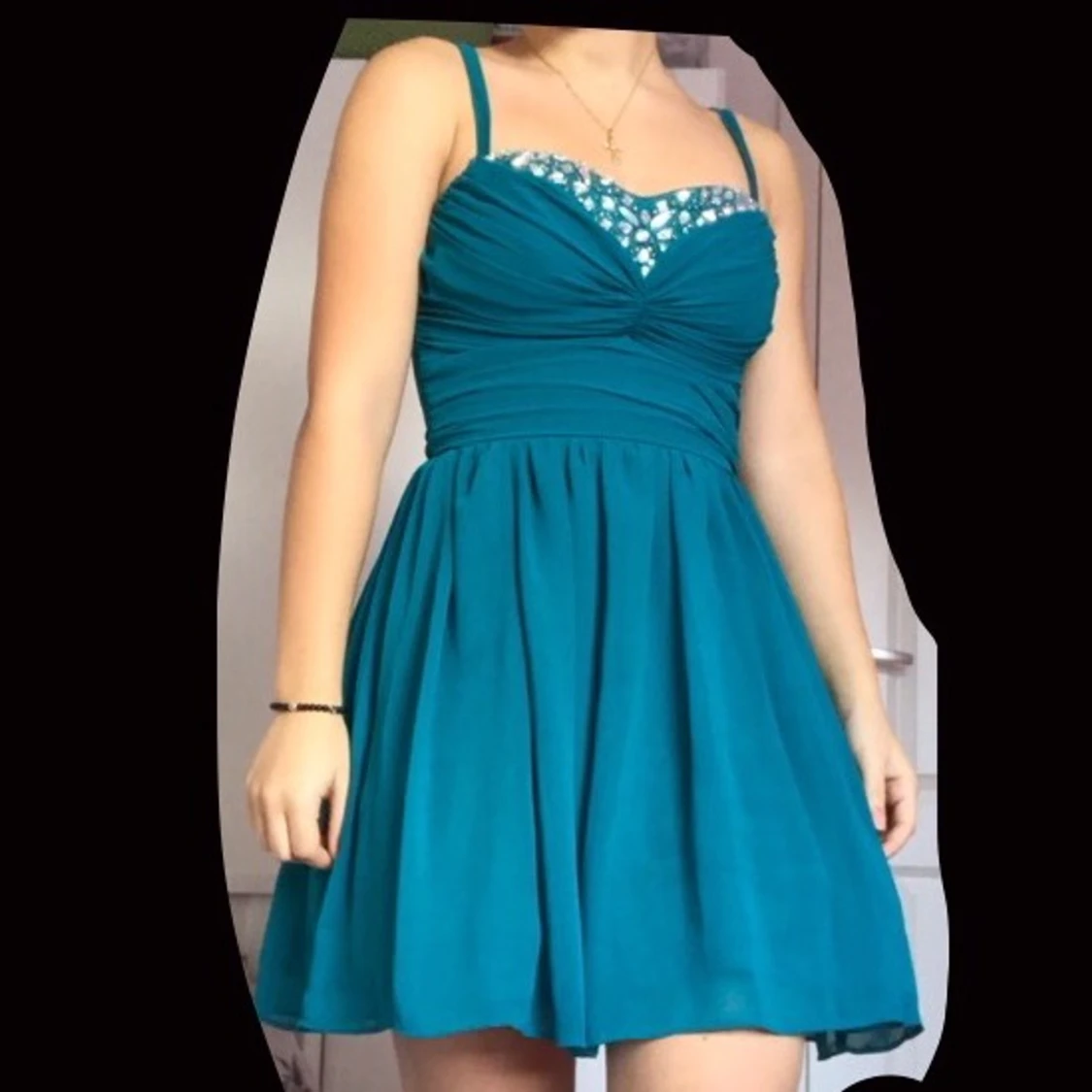 Blå/grön festklänningens paljetter