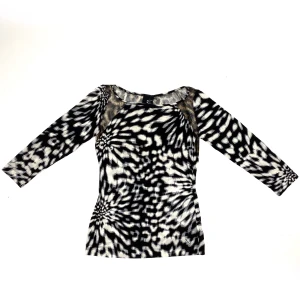 Roberto Cavalli Printed Top - 100% Elastane. The model is 173 cm tall. Shoulder to shoulder: 38 cm  Length: 59 cm 