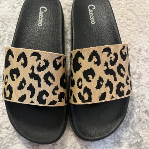 Leopard tofflor  - Storlek 38, aldrig använt