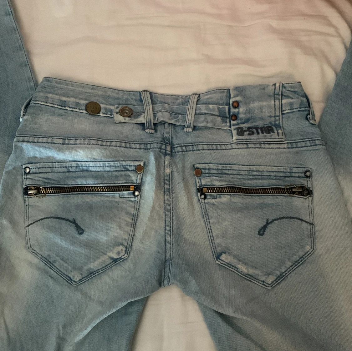 Lågmidjade ljusblåa bootcut jeans - 91