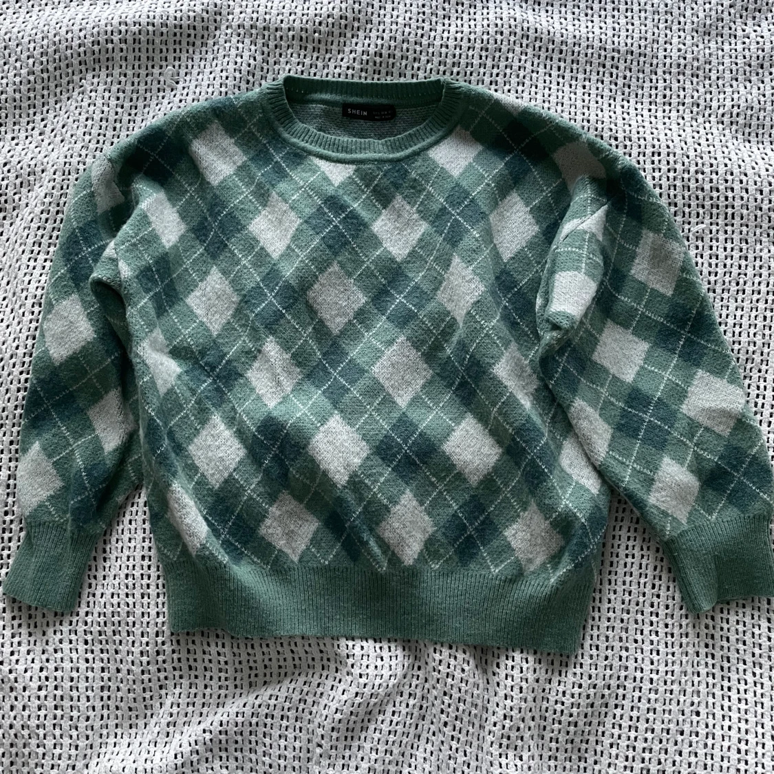 Grön stickad rutig tröja