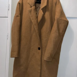 Beige kappa - Bra i storleken. Knappt använd. 