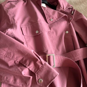 Dusty pink raincoat trench  - Next Rainwear collection Trench raincoat with hood dusty pink colour Size 16/44, looks great as oversized for smaller size 170/100A Shell - 55% polyester, 45% cotton Lining - 100% polyester  Very good condition