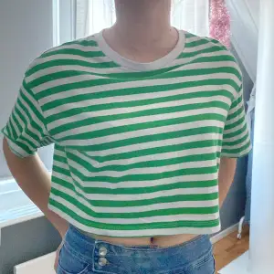 A green and white striped t shirt, short, only used a few times, good condition 