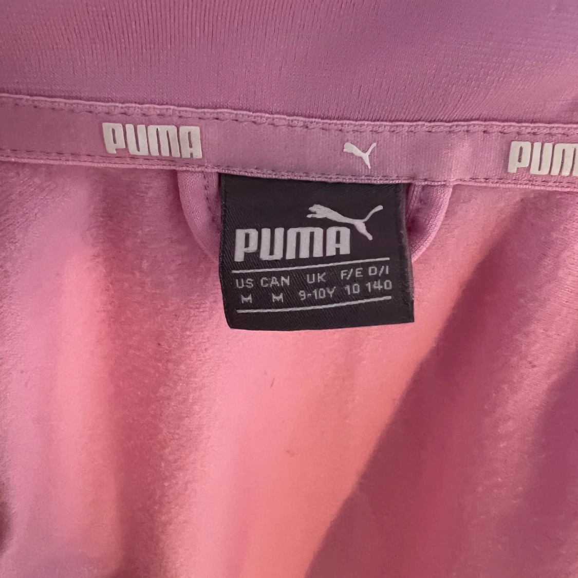 Rosa/vit sport flis från puma storlek 140 unisex - 91