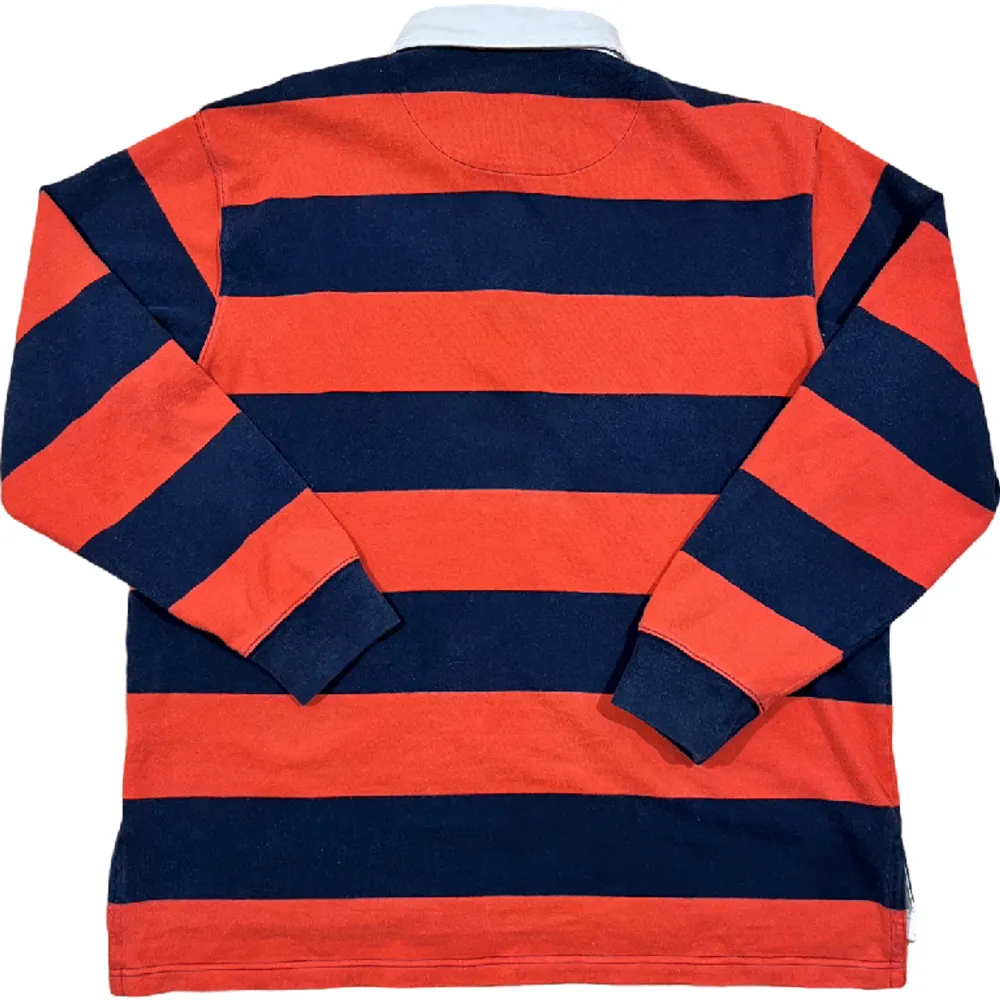 Orange och blå randig rugby tröja från Ralph Lauren. Populariserad av Kanye West. Väldigt ovanlig tröja, ställ gärna frågor!😊. Tröjor & Koftor.