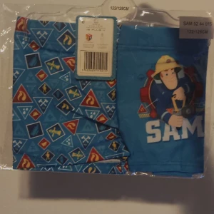 Nya! Fireman Sam Bad shorts  för barn  7-8 år  storlek 122/128  - Nya! Fireman Sam  Bad shorts / badbyxor för barn  7-8 år  storlek 122/128 * Nya  * Hela  * Rena  * Fri frakt vid köp över 1000sek