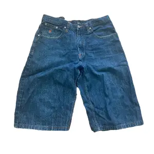 Jorts boast a measurement of 44x65 dark blue Crafted by Roca Wear they embody both comfort and fashion