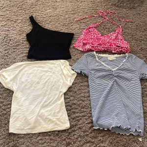 4-pack med tröjor/toppar - Jag säljer ett pack med 2 stycken t-shirts och 2 stycken toppar i storlek Xs. Alla plagg är i nyskick. Dom kommer från hm, second hand och shein. 