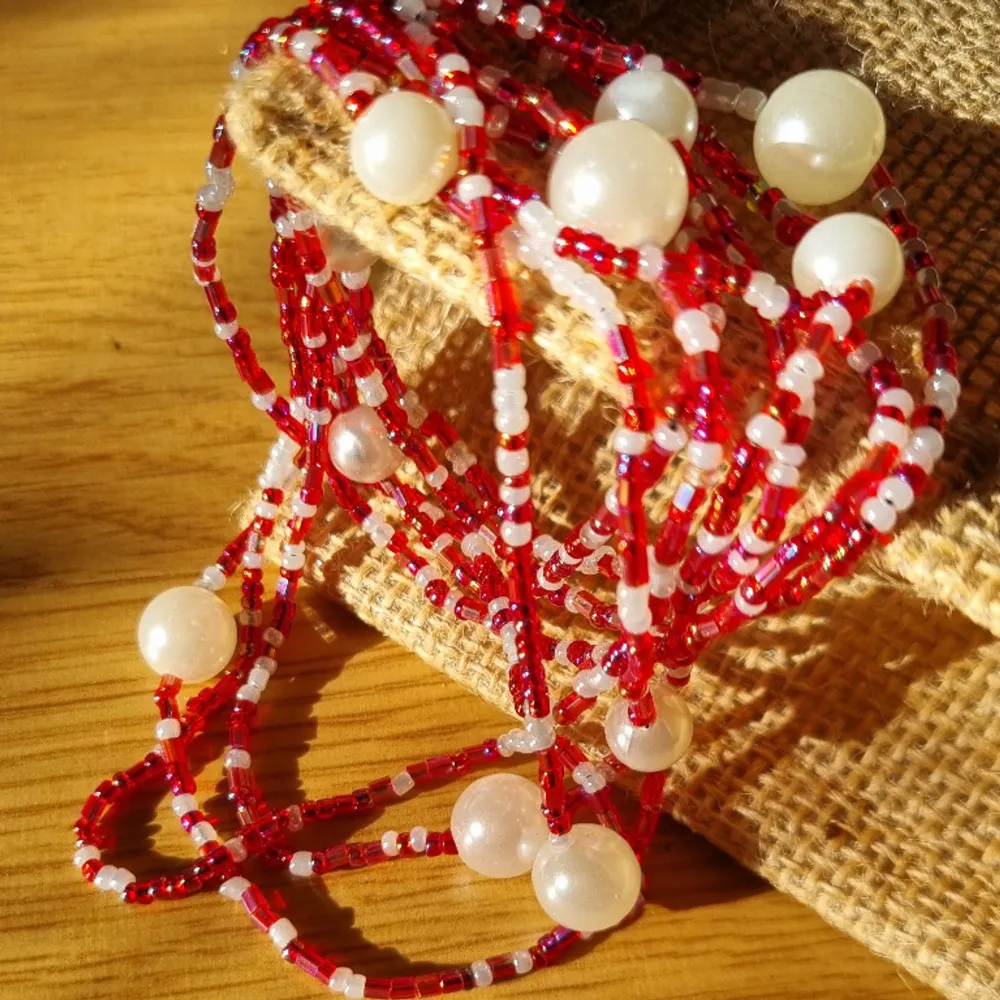 Mix acrylic white pearls and red glass beads, in a long fashion necklace. Long strand of mix beads and pearls that can signify your uniqueness and express yourself in style.   Handmade/Handcrafted.  3way fashion accessory necklace,bracelet and anklet. Accessoarer.