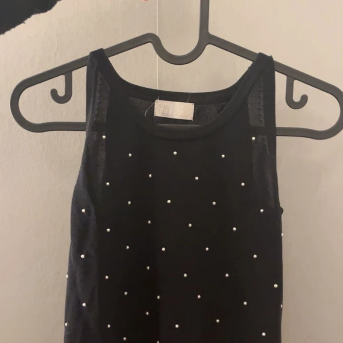 En svart jättefint linne