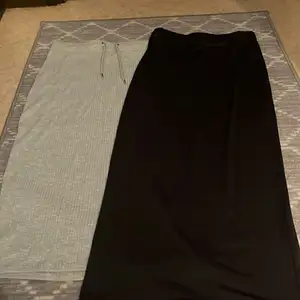  här säljer två stycken långa kjolar den ljusgråa är i från Gina Tricot i storlek L och den svarta långa kjolen är från SHEIN och är storlek M och L
