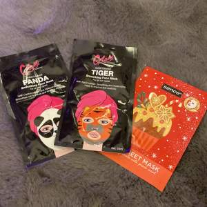 3 stycken ansiktsmasker en panda en tiger och en vanlig vit en kostar 10kr