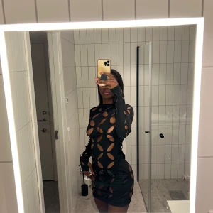 Black dress - Black dress designed with holes. Light fabric. 