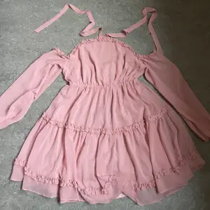 Pink off-shoulder dress with ruffles from nakd, used once. Size 38, fits S and M. The two bands go around the neck. 