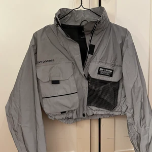 Reflex Jacka - Reflex jacka som går över midjan XS Perfekt för festival