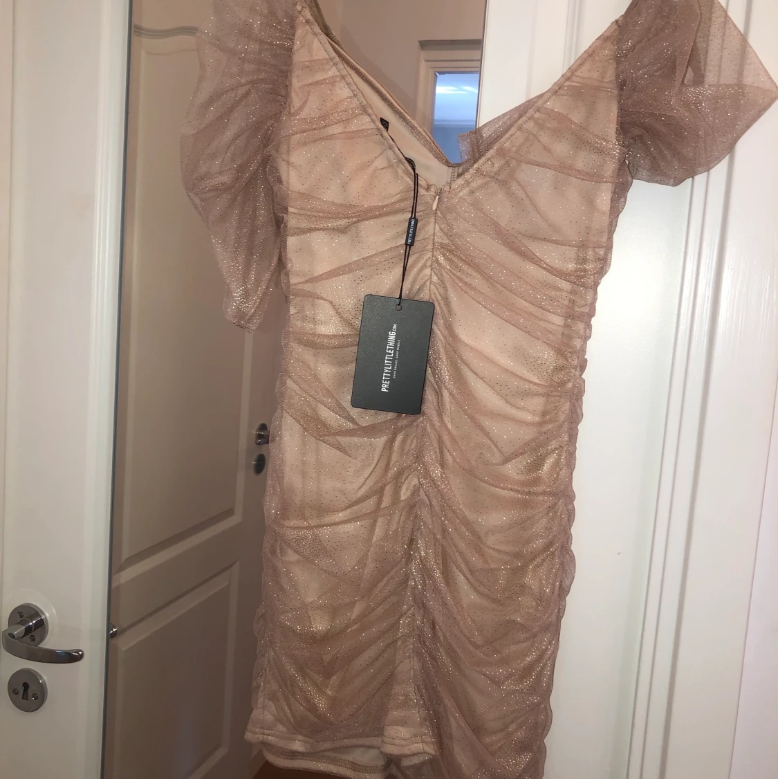 Glittrig klänning - 91