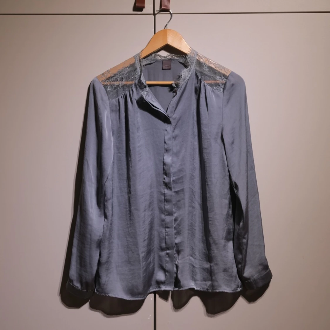 Blue silk blouse with lace on shoulders