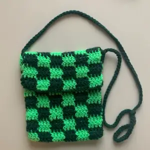 handmade checkered bag, crocheted with 100% acrylic yarn. the different shades of green means that it goes well with almost any outfit!