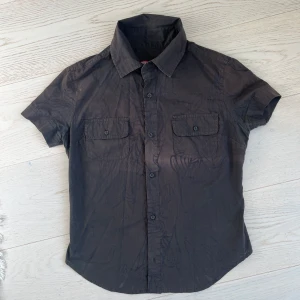 Diesel shirt - Original Diesel shirt with nice semi see-through organic print. In good condition, fabric shows slight decolorisation as pictured.