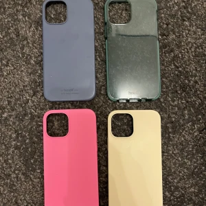 iPhone 12 skal - Alla skal från Holdit. Det blå skalet har en skada i ett hörn se bild. Säljer för 40kr, dem övriga kostar 60kr/st. (Obs Rosa är sålt!)