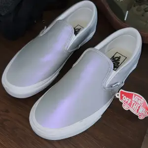 Special edition slip on vans! They are reflecting in head- and flashlights :]   Never been used. Size 40 EU unisex! 