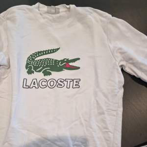 Lacoste sweatshit, bra skick storlek M.